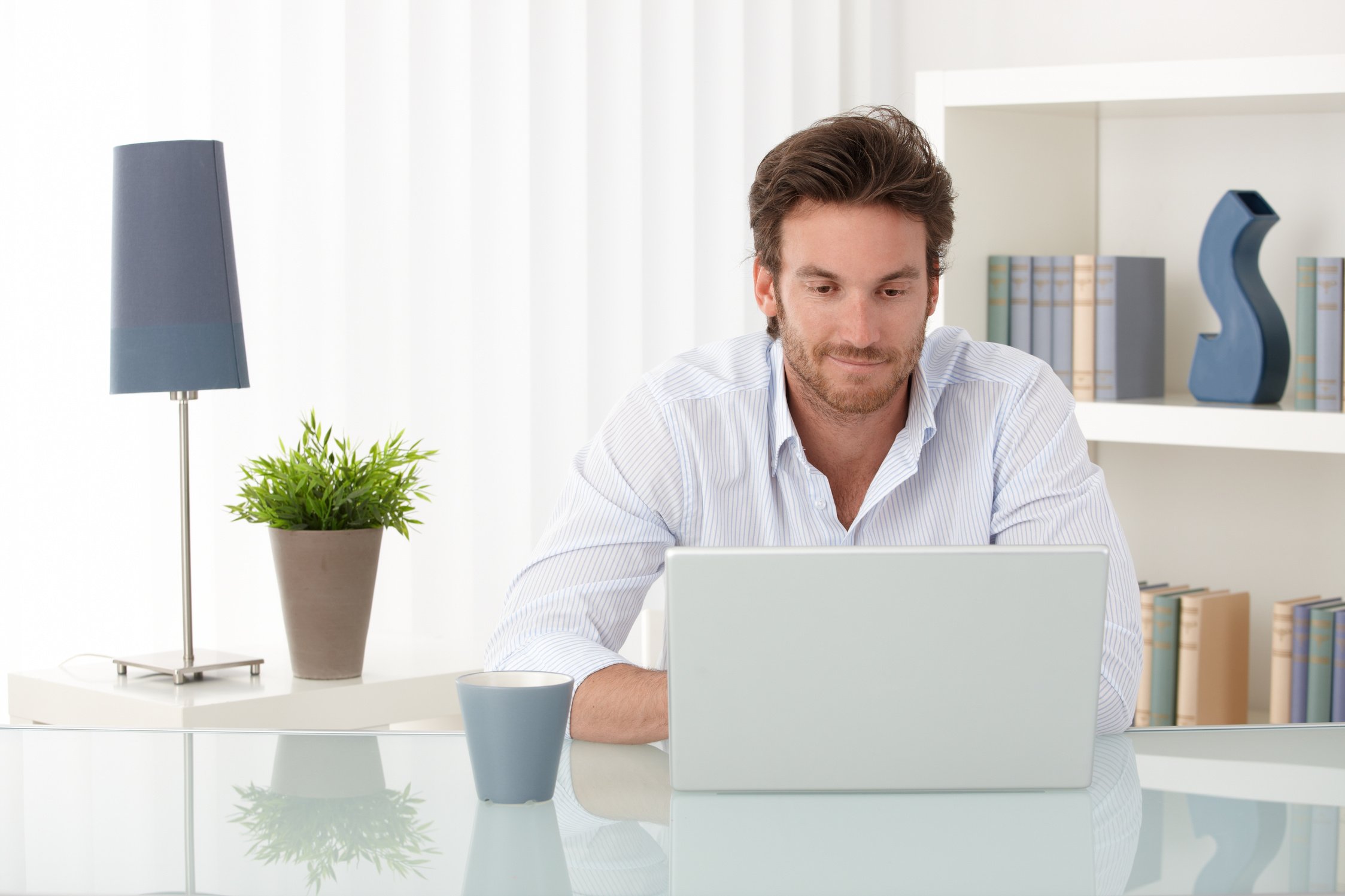 Man with Computer at Home